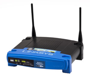 Router Linksys WRT54GS fotografiado por Evan-Amos en 2011; referencia temática de redes domésticas, sin relación con un operador investigado